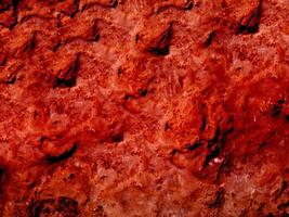Textur aus rotem Stein im Garten foto