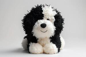 ai generiert flauschige schwarz und Weiß Hund auf ein Weiß Hintergrund. flauschige Spielzeug im das bilden von ein Hund foto