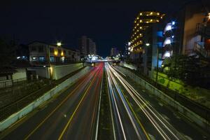 ein Nacht der Verkehr Marmelade beim das Innenstadt Straße im Tokyo breit Schuss foto