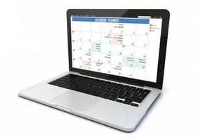 Laptop-Kalender auf weißem Hintergrund foto