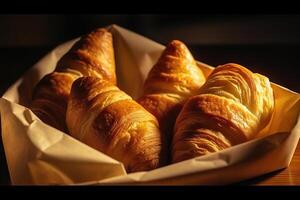 ai generiert frisch gebacken Freuden Croissants eingewickelt im ein Papier Tasche. erstellt mit generativ ai foto