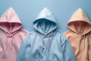 ai generiert viele von bunt Hoodies hängend auf Blau Hintergrund foto