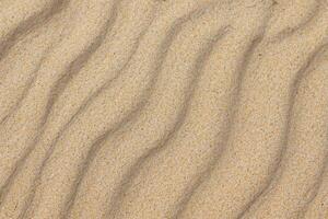 Sand von Gelassenheit Umarmen das Schönheit von natürlich Motiv Sand, ein still Tapisserie von Erde Muster foto