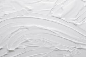 glatt Weiß kosmetisch Körper Pflege Sahne Textur Hintergrund. foto