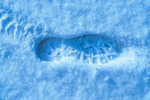 Stiefel Spur auf ein Schnee im Winter. foto