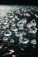 Diamanten auf ein schwarz Oberfläche mit Wasser foto