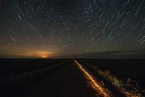 ai generiert ein lange Exposition von das Nacht Himmel mit Star Wanderwege foto