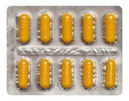 Oval Gelb Tablets im Weiß Plastik Verpackung foto