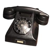 Vintage Telefon mit Wählscheibe isoliert über weiß foto
