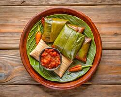 oaxacan Tamale gedämpft Hähnchen oder Maulwurf im Banane Blatt foto