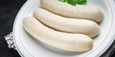 Weiß Würstchen Fleisch Weißwurst bayerisch Würste zweite Kurs frisch Kochen Vorspeise Mahlzeit Essen Snack auf das Tabelle Kopieren Raum Essen Hintergrund foto