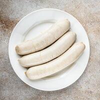 Weiß Würstchen Fleisch Weißwurst bayerisch Würste zweite Kurs frisch Kochen Vorspeise Mahlzeit Essen Snack auf das Tabelle Kopieren Raum Essen Hintergrund foto