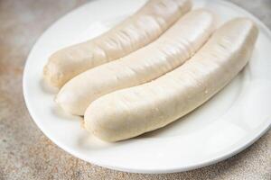 Fleisch Weiß Würstchen Weißwurst bayerisch Würste Kochen Vorspeise Mahlzeit Essen Snack auf das Tabelle foto