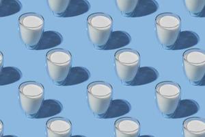 Weltmilchtag. Muster auf blauem Hintergrund. ein Glas Milch. Muster. foto