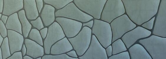 Muster im antiken Stil Design dekorative unebene rissige Wandfläche aus echtem Stein mit Zement. alte heilige grabfassade mit sonnenlicht foto