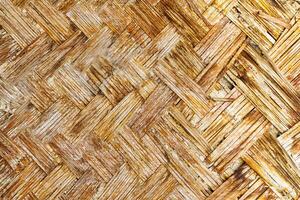 das Textur von das Rahmen von ein orientalisch Gebäude gemacht von gewebte Bambus. abstrakt Hintergrund. foto