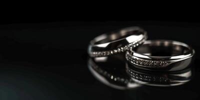 Hochzeit Ringe auf ein schwarz Hintergrund foto