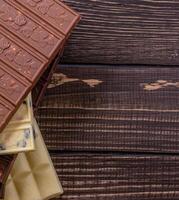 Schokolade Bar Stücke. Hintergrund mit Schokolade. Süss Essen Foto Konzept.