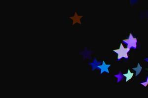 Licht bunter blauer Stern Lichteffekt isolierte Overlay-Glitter-Textur auf Schwarz. foto