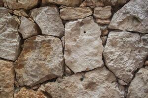 Textur von Steine auf das Mauer foto