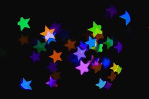 Licht bunter blauer Stern Lichteffekt isolierte Overlay-Glitter-Textur auf Schwarz. foto