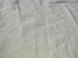 Stoff Hintergrund Weiß Leinen- Segeltuch zerknittert natürlich Baumwolle Stoff natürlich handgemacht Leinen- oben Aussicht Hintergrund organisch Öko Textilien Weiß Stoff Leinen- Textur foto