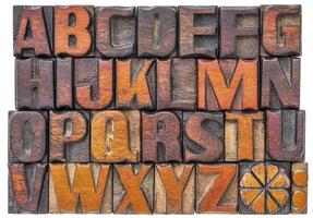 Alphabet abstrakt im Holz Art foto