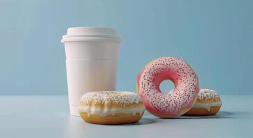 ein Tasse von Kaffee und drei Donuts auf ein Tabelle foto