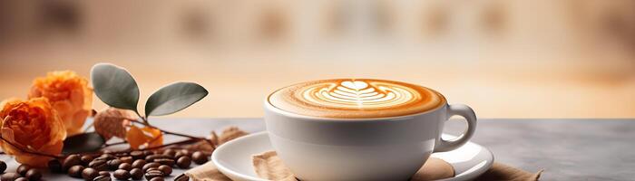 ein Tasse von Kaffee mit ein schön Latté Kunst Design auf ein Untertasse, Nächster zu ein klein Stapel von Kaffee Bohnen und ein Rose. das Hintergrund ist ein verschwommen Cafe Innere. foto