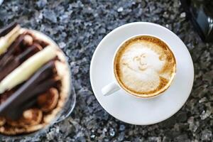 Smiley Gesicht Tasse von Kaffee foto