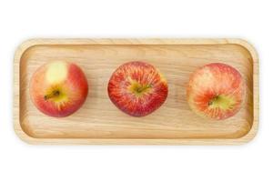 Äpfel auf einem Holzteller foto