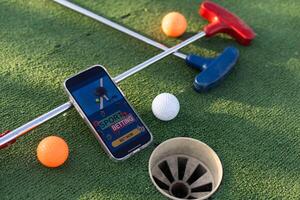 Mini Golf Sport Wetten auf ein Smartphone foto