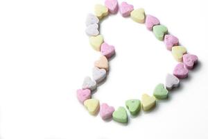 Rosa und lila Herz geformt Süßigkeiten. Valentinstag Tag Hintergrund. 6 foto