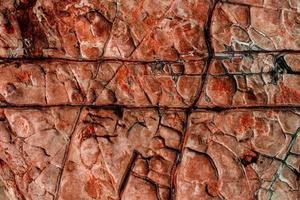 braune Steinstruktur isoliert und riesige Sammlung von Granitsteinen Hintergrund foto