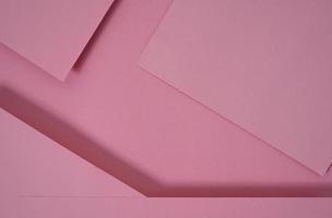 abstrakter Pop-up-Papierhintergrund in Rosa. abstrakte Arrangements bilden eine geometrische Textur für Tapeten, Poster, Flyer usw. foto