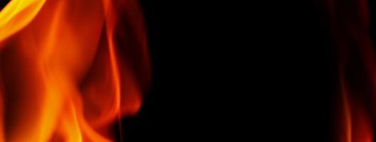 Feuer Hintergrund. abstrakte brennende Flamme und schwarzer Hintergrund. foto
