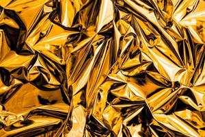 zerknitterter goldener abstrakter Texturhintergrund foto