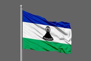 Lesotho wehende Flagge Illustration auf grauem Hintergrund foto