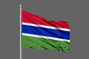 Gambia wehende Flagge Illustration auf grauem Hintergrund foto