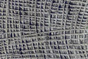 abstrakter grauer Steinquadratwand realistische Beschaffenheitsverzierung, die Felsen auf Natur baut. foto