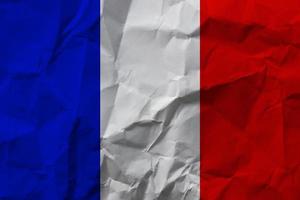 französische Nationalflagge auf zerknittertem Papier. foto