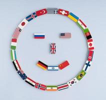 Abbildung eines Smileys von Nationalflaggen auf Dominosteinen. Konzept des Friedens und des Gemeinwesens der Nationen und der Weltordnung foto