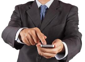 Geschäftsmannhand mit Touchscreen-Handy foto