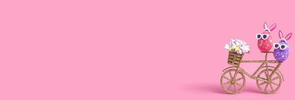 osterkomposition auf rosa hintergrund, ein ei mit hasenohren und sonnenbrille, nahaufnahme mit kopierraum foto