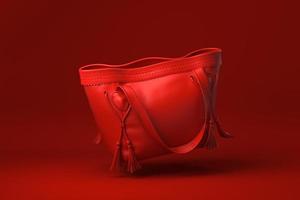 rote Tasche Damenmode-Accessoires schwebend in rotem Hintergrund. minimale konzeptidee kreativ. 3D-Rendering. foto