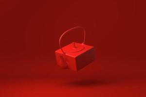 rote Teekanne, die im roten Hintergrund schwimmt. minimale konzeptidee kreativ. einfarbig. 3D-Rendering. foto
