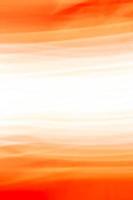 abstrakter orangeroter Hintergrund mit einem weißglühenden Zentrum. vertikales Banner. bietet Platz für Text. foto