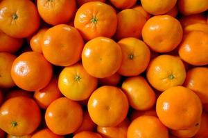 Obsttapetenhintergrund, orangefarbener Texturhintergrund, orangefarbener Tapetenhintergrund foto