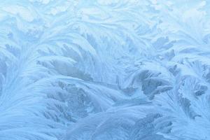 Frostbeschaffenheit auf dem gefrorenen Fenster. foto