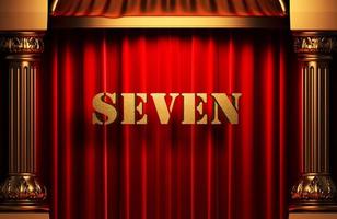 Sieben goldenes Wort auf rotem Vorhang foto